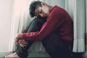 Young man who appears sad.